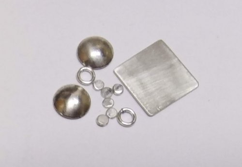 Judy Larson's Tiny Silver Charms part 1 - , Contemporary Wire Jewelry, How To Punch Holes, Hole Punching, Punch A Hole, Texturing, Butane Torch, Soldering, Solder, tiny charms